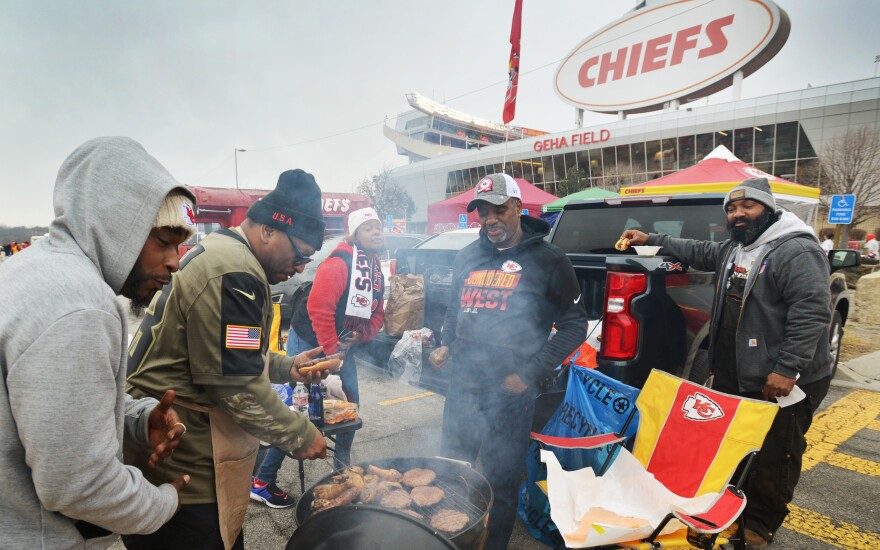 Fans tailgate outside Arrowhead Stadium just before the Chiefs' 2023 playoff game against the Jacksonville Jaguars.