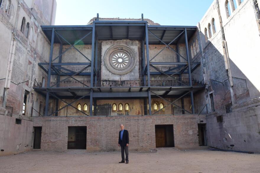 Former Phoenix Mayor and Arizona Attorney General Terry Goddard stands in the atrium of the First Baptist Church in downtown Phoenix.