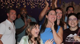 Crystal Quade, Democratic candidate for Missouri Governor, and her daughter react as election results are shown (photo taken August 6, 2024).