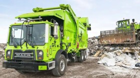 GFL trucks working at a landfill.