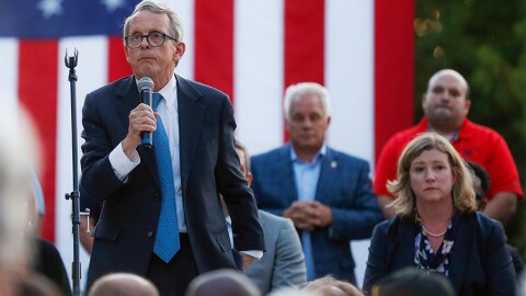 Ohio Gov. Mike DeWine, left, speaks alongside Dayton Mayor Nan Whaley, right, during a vigil at the scene of a mass shooting, Sunday, Aug. 4, 2019, in Dayton.