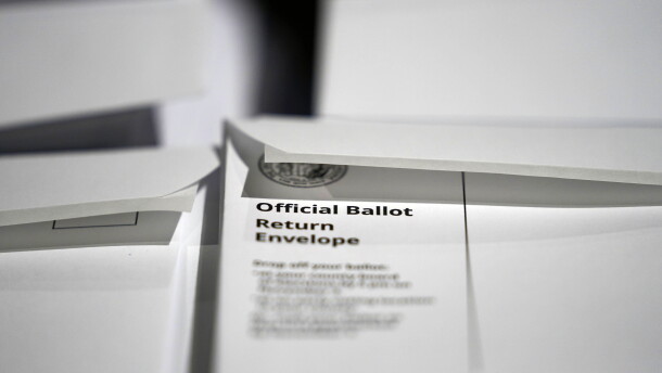 In this Thursday, Sept. 3, 2020, file photo, stacks of ballot envelopes waiting to be mailed are seen at the Wake County Board of Elections in Raleigh, N.C.