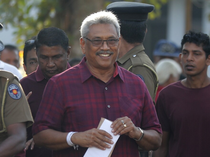 Sri Lanka's former Defense Secretary and presidential candidate Gotabaya Rajapaksa leaves a polling station after casting his vote in Embuldeniya, on the outskirts of Colombo, Sri Lanka on Saturday.