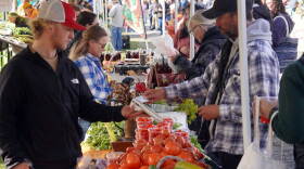 Attendees browse booths filled with fruits and vegetables during the Harvest Moon Local Food Festival at Soldotna Creek Park in Soldotna, Alaska, on Saturday, Sept. 26, 2026.