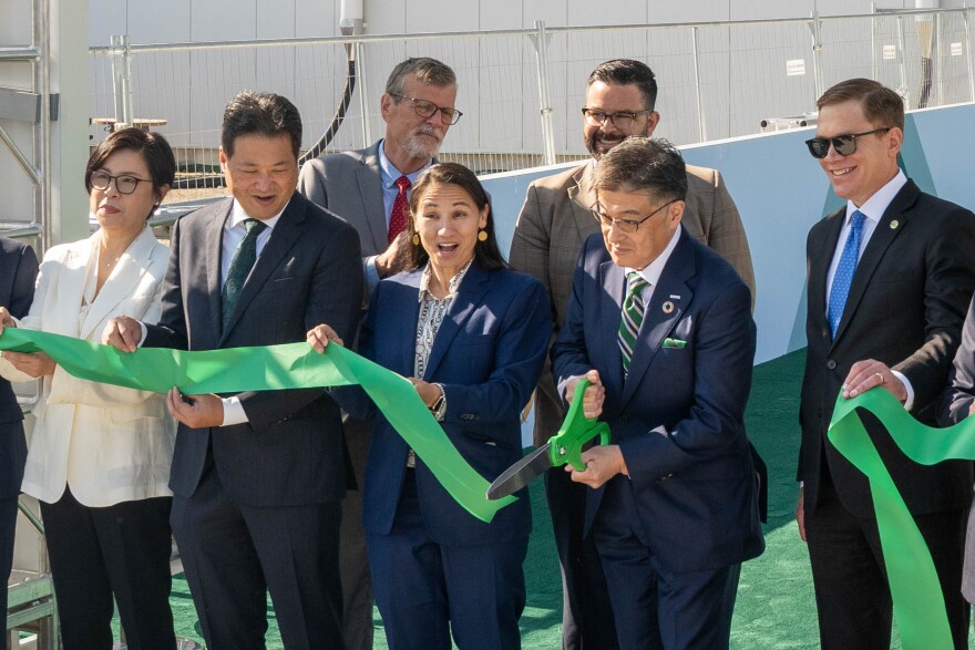 Political and business leaders cut the ribbon to open Panasonic's battery plant in De Soto, Kansas. From left: Shigeo Yamada, Japanese Ambassador to the United States; Megan Myungwon Lee, Chairperson and CEO of the Panasonic Corporation of North America; Kazuo Tadanobu, President and CEO of Panasonic Energy Co., Ltd; Rep. Sharice Davids for Kansas' 3rd district; Yuki Kusumi, Panasonic CEO; David Toland, Lieutenant Governor and Secretary of Commerce for Kansas