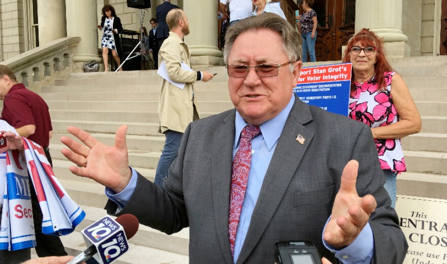 FILE - Shelby Township clerk Stan Grot speaks with reporters at the Capitol in Lansing in 2017. Grot is running for reelection as the township clerk. He has been barred from running any elections after being charged last year by the state attorney general for acting as a false elector in 2020 for then-President Trump