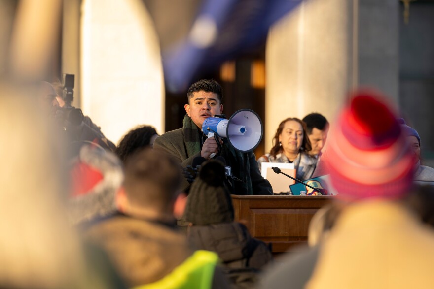When the podium speaker system failed, organizer Juan Fonseca Tapia and other speakers delivered their messages through a megaphone.