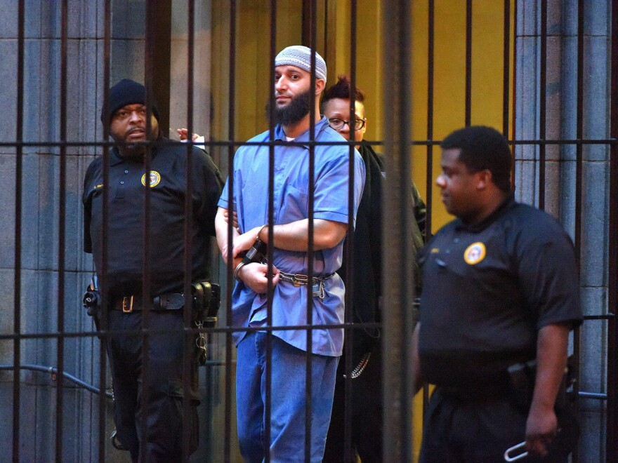 Adnan Syed, subject of the podcast <em>Serial</em>, is escorted from a courthouse in February 2016. An appellate court has upheld a previous decision to vacate Syed's 2000 conviction