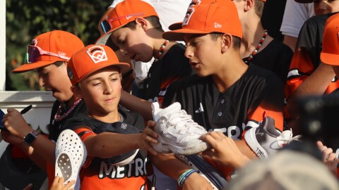 Players sign autographs on Monday night.