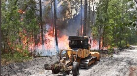 bulldozer figthing forest fire