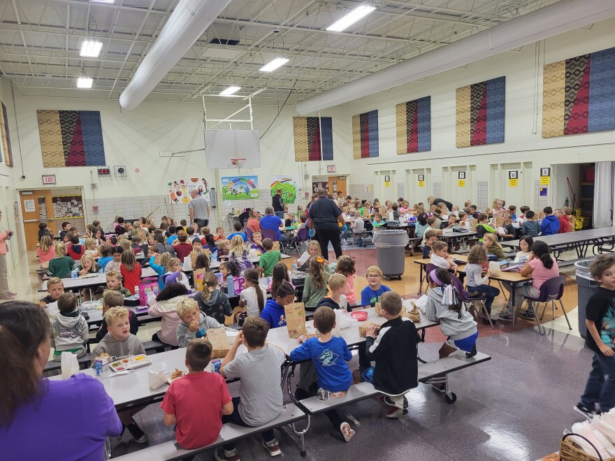 Second graders at Stephen Bell Elementary enjoy lunch in the cafeteria.