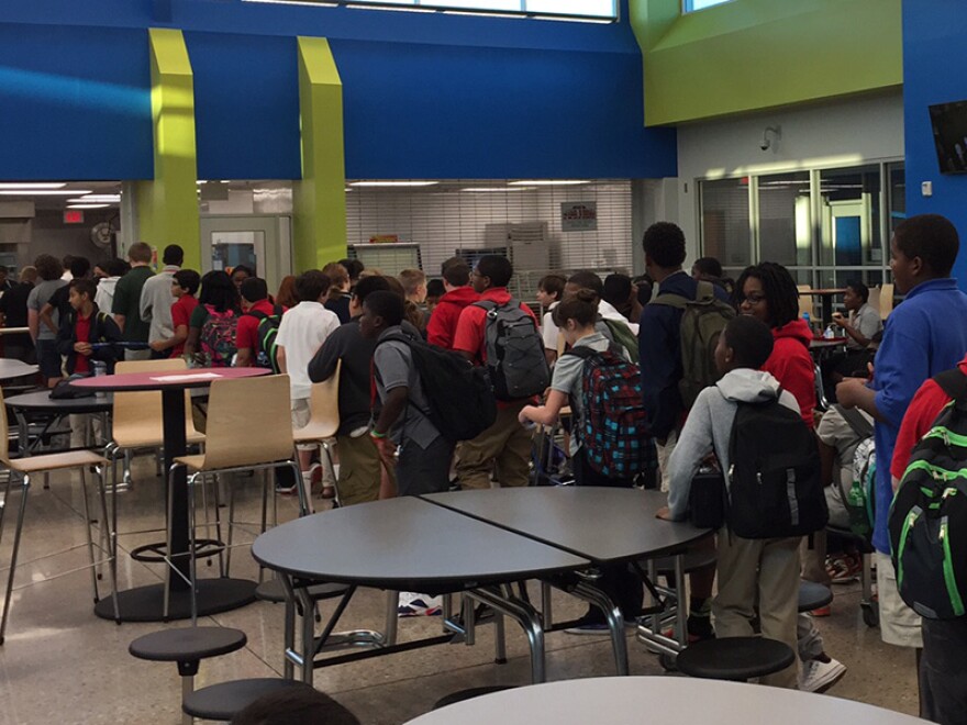 Students line-up for food at Fisher Middle School in Greenville.