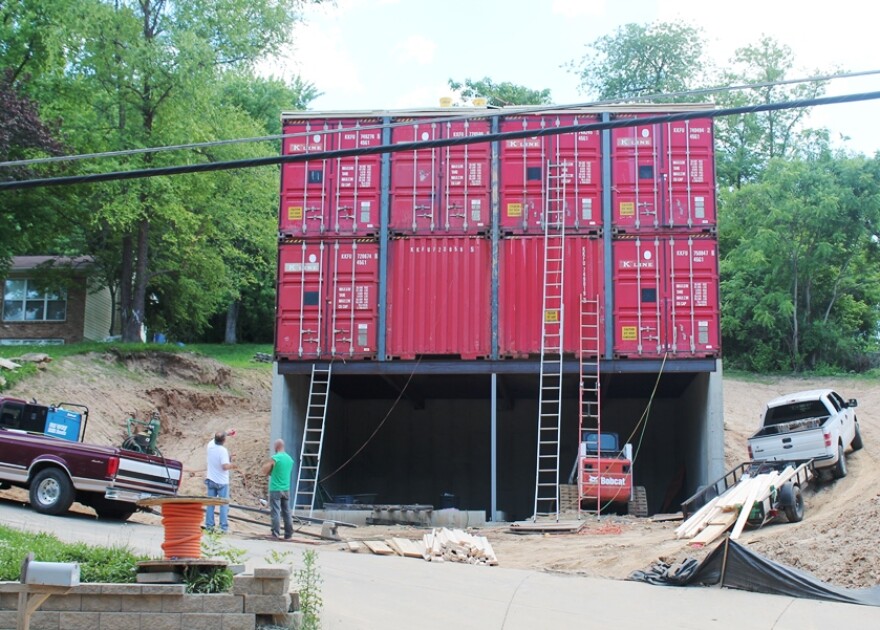 Street view of the container house on Elm Street in St. Charles. Steve and Zack Smithey are standing in front.