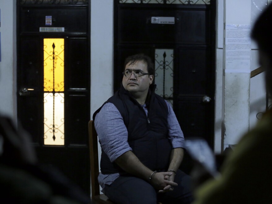 Javier Duarte, the former governor of the Mexican state of Veracruz, sits handcuffed following his arrest in Panajache, Guatemala, on Saturday.