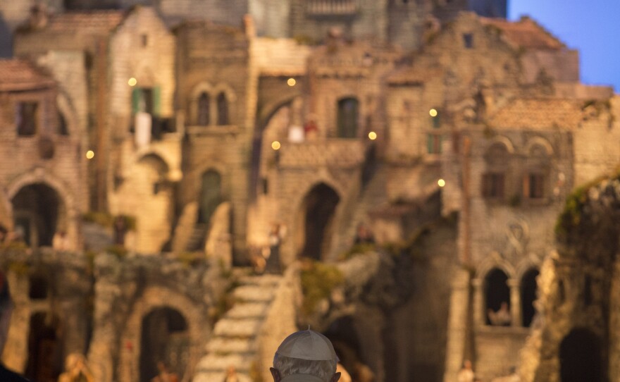 Pope Benedict XVI prays in front of the Nativity in St. Peter's Square at the Vatican. He marked the end of the year by saying that despite all the death and injustice in the world, goodness prevails.