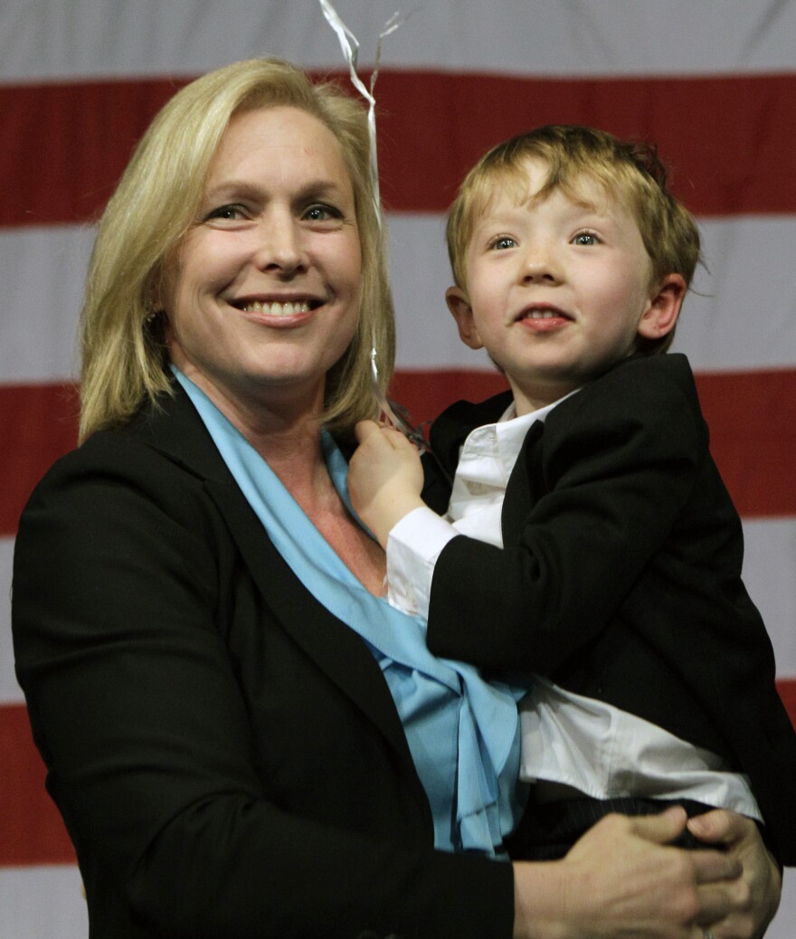 Sen. Kirsten Gillibrand holds her son Henry, 4, after greeting supporters at New York State Democratic Headquarters on Nov. 6. The 2009 appointee won her first six-year term with 72 percent of the vote.