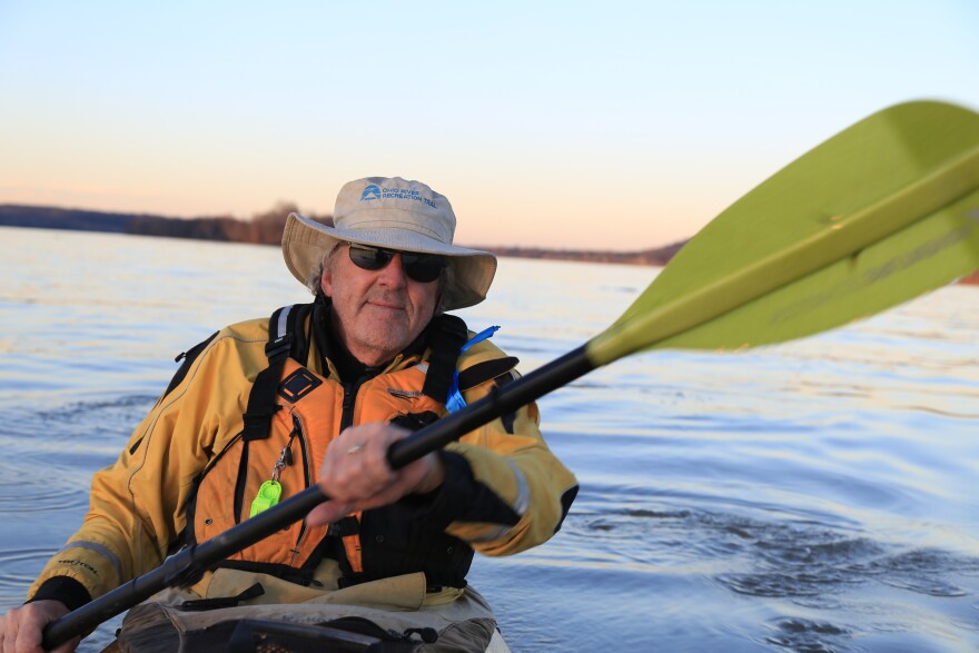 Educator and environmentalist David Wicks paddling on the Ohio River near Prospect, Kentucky.