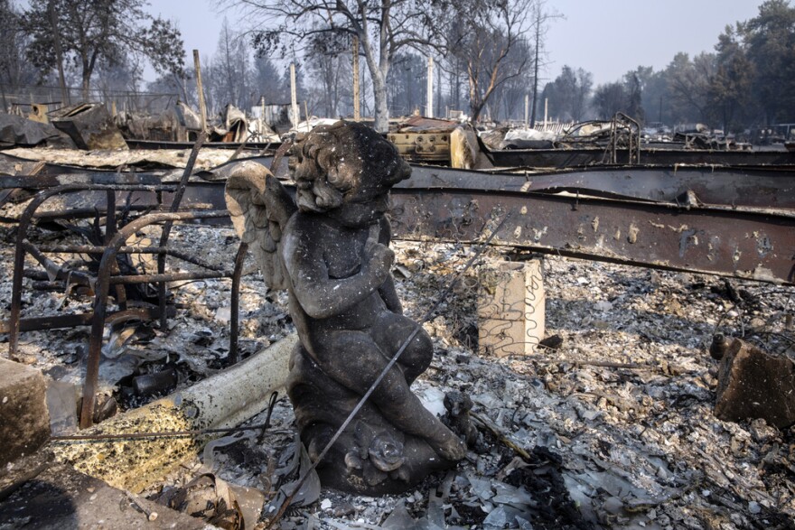 A charred statue sits among the destruction at Coleman Creek Estates mobile home park in Phoenix, Ore., Thursday, Sept. 10, 2020. The area was destroyed when a wildfire swept through on Tuesday, Sept. 8. A trial started Tuesday, April 25, 2023, in connection with a $1.6 billion class action lawsuit against utility PacifiCorp over the catastrophic Labor Day 2020 wildfires in Oregon.