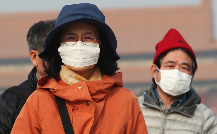 Smog hits Beijing on December 1. A new report presents evidence of cleaner air, but environmental observers are worried about levels of pollution this winter.