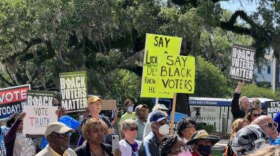 Voters from across Congressional District 5 rally outside the Old Florida Capitol Building on Tuesday, April 19, 2022 in protest of Gov. Ron DeSantis congressional map, which was temporarily blocked by a state circuit court judge about three weeks later. (Valerie Crowder/WFSU News)