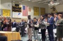 People holding their hand up while giving Oath of Allegiance, the final step to giving citizenship at a ceremony in Kettering on February 12.