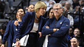 FILE - UConn associate head coach Chris Dailey speaks with UConn head coach Geno Auriemma during the first half of an NCAA college basketball game against North Carolina, Sunday, Dec. 10, 2023, in Uncasville, Conn. (AP Photo/Jessica Hill, File)