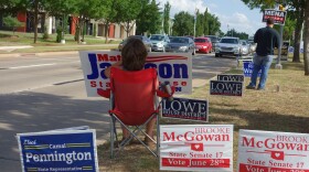 Campaign supporters held signs and waved to motorists Thursday as they passed the Oklahoma County Board of Elections.