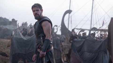 Odysseus, played by Matt Damon, stands in front of a number of ships and men preparing to sail away from Troy after the end of the Trojan War. 
