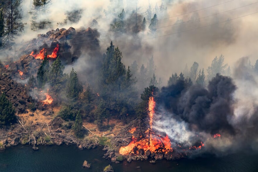 The Bench fire burns along the banks of the Deschutes River on Saturday, July 25, 2026, in Jefferson County, Ore.