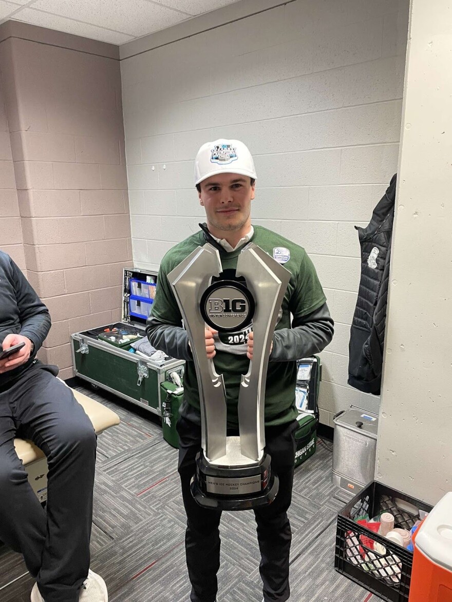 Cheli with the 2024 Big Ten Regular Season Championship Trophy.