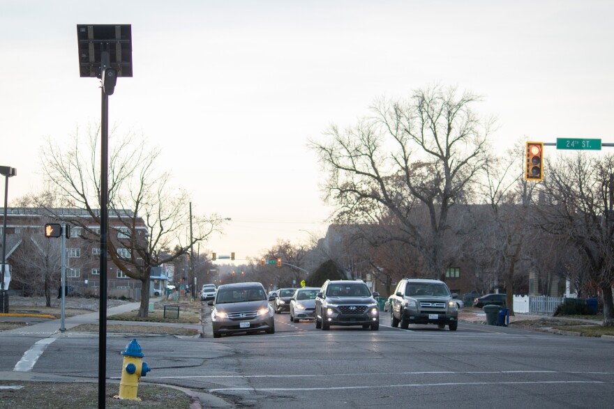 Drivers wait to cross 24th Street on Monroe Boulevard in Ogden, where a Flock automatic license plate reader is stationed, Jan. 21, 2026