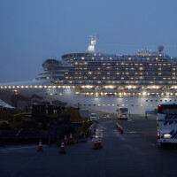 Buses arrive at Yokohama Port, near Tokyo, as the Japan Self-Defense Forces prepare to move American passengers from the quarantined Diamond Princess cruise ship on Sunday.