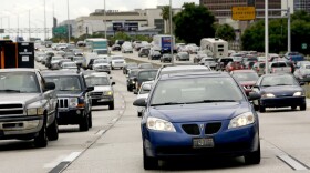 Rush-hour traffic makes its way along Interstate 4 in Orlando, Fla. A more than $2 billion project to reconstruct 21 miles of the highway is underway. (John Raoux/AP)