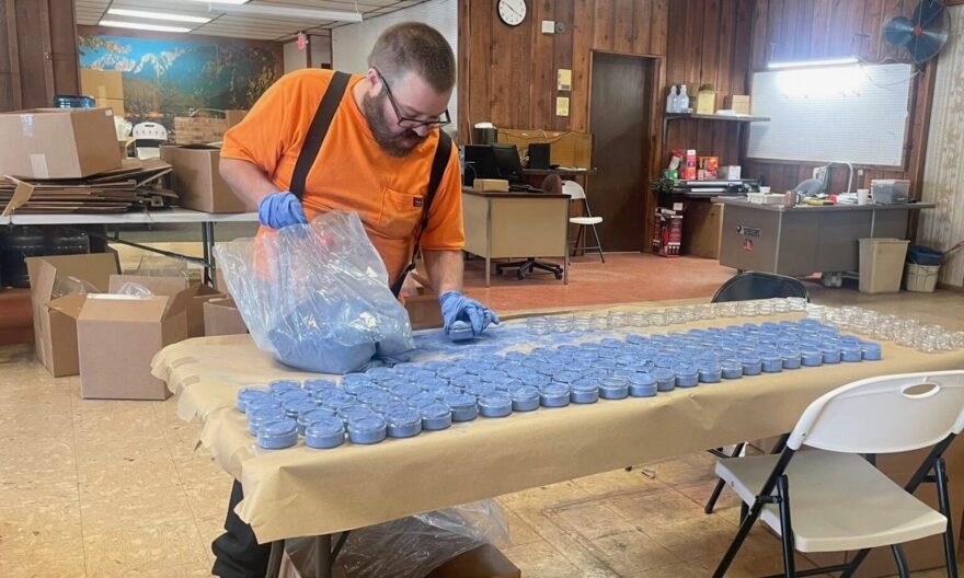 Andrew Ashelman fills jars with milk paint at Scenic River Industries Inc., a sheltered workshop in Salem, Missouri. A fire destroyed the workshop’s facility in December and the future is uncertain after lawmakers did not pass a $2.5 million appropriation to help with rebuilding