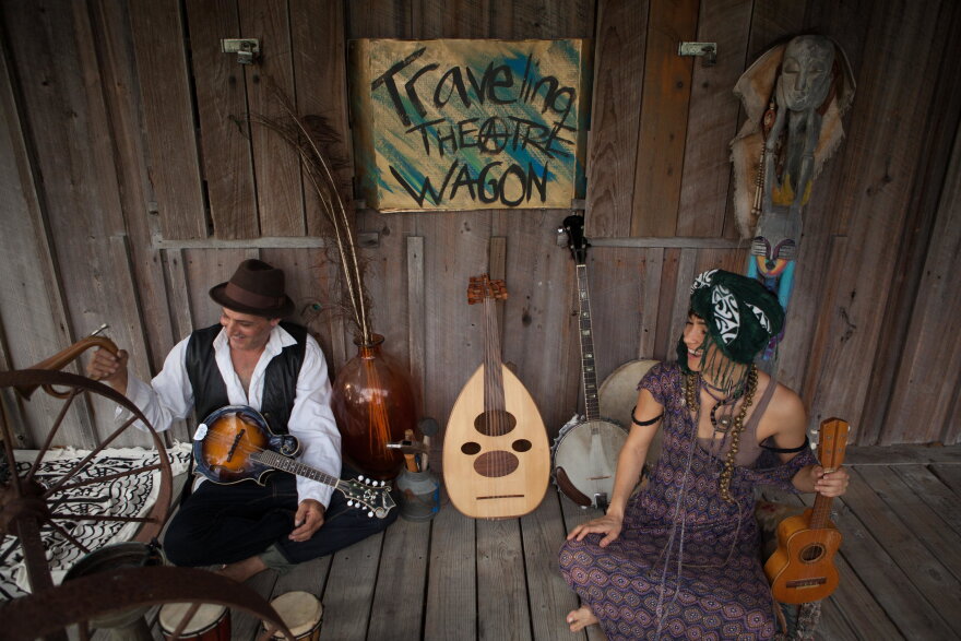  Shira Lee, right, sits on the Babawagon, a traveling stage that is bringing art outside of the box.  
