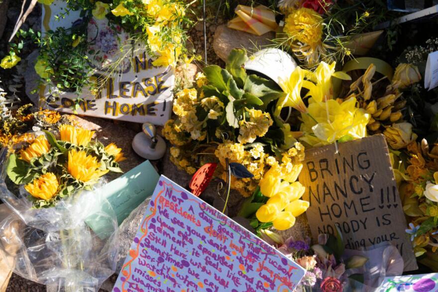 An ever-growing collection of yellow flowers and notes sit at the home of Nancy Guthrie, the missing mother of "Today" show host Savannah Guthrie, in Tucson, Ariz., Friday, March 6, 2026. (Rebecca Noble/AP)