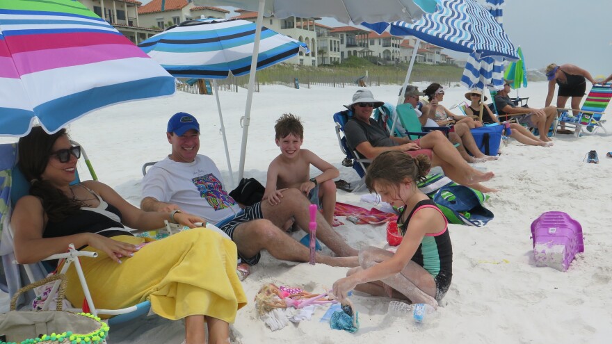 Daniel Ulhfelder, his family and other activists hold a "sit-in" on the Vizcaya beach in defiance of the recently passed Florida law.