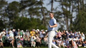 Justin Rose waves after making a putt on the 18th hole during the first round at the Masters golf tournament, Thursday, April 10, 2025, in Augusta, Ga. (AP Photo/David J. Phillip)