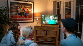 A family in the village of Hartley Wintney watches Britain's Queen Elizabeth II deliver a special address to the UK and  Commonwealth recorded at Windsor Castle in relation to the coronavirus outbreak.