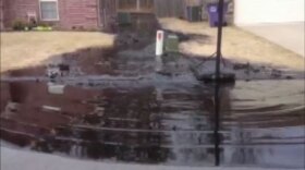 oil spilling into neighborhood