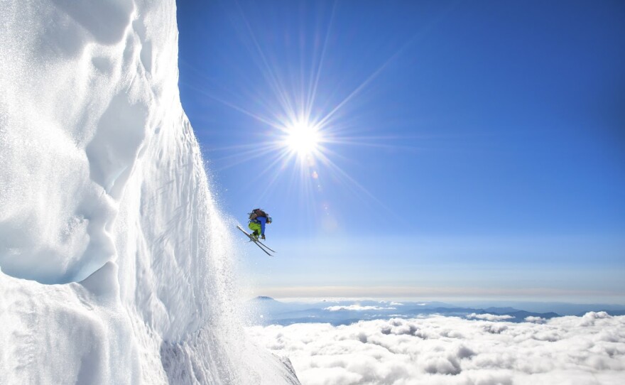 Jason Hummel photographs a skier making his way down Mt. Adams