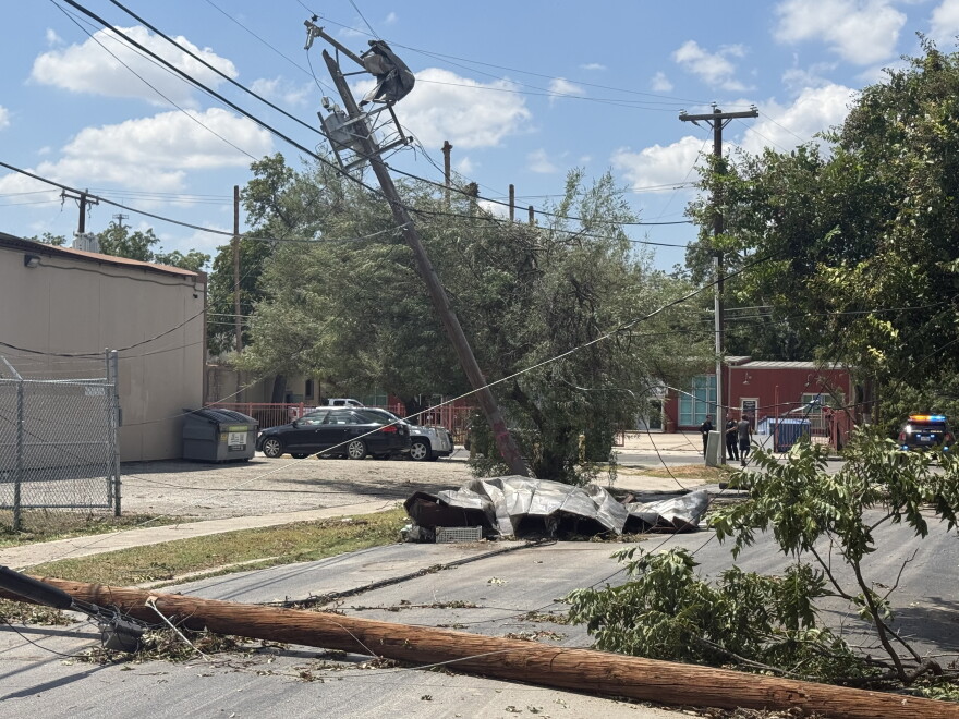 Storm damage at Flores and Cypress streets in San Antonio, where high winds brought down utility poles, power lines and tree limbs following Friday night’s severe storms.