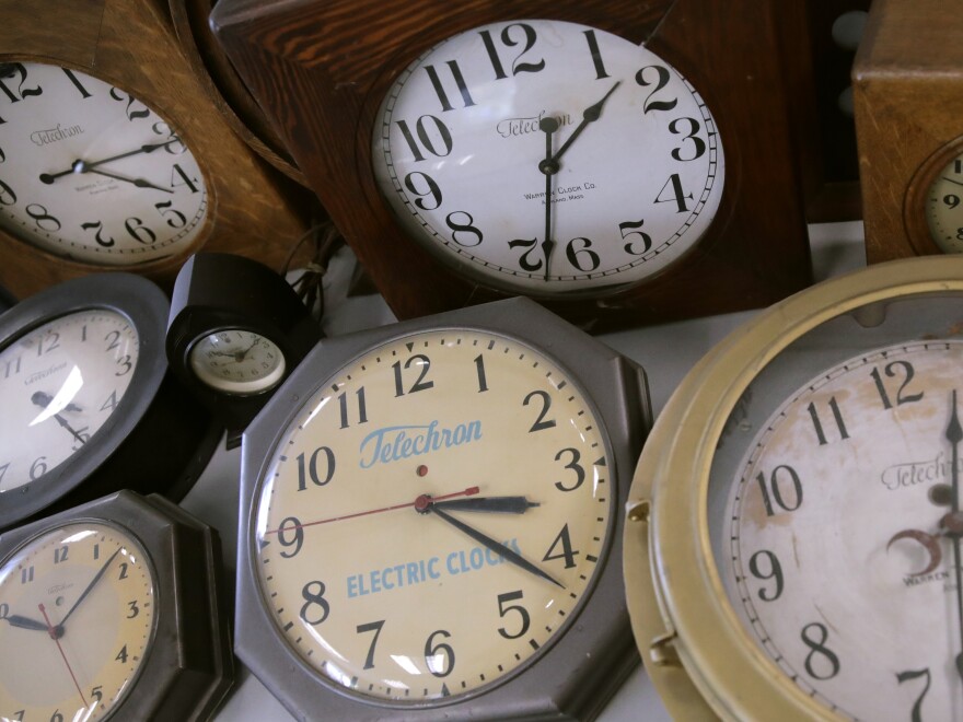 In this March 5 photo, antique clocks are displayed at the Electric Time Company in Medfield, Mass. Daylight saving time returns Sunday at 2 a.m. local time.