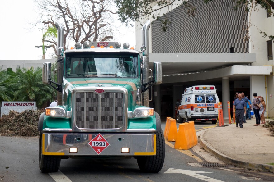 A truck hauling diesel leaves the University of Puerto Rico's Medical Center, which is operating on diesel-powered generators following Hurricane Maria.