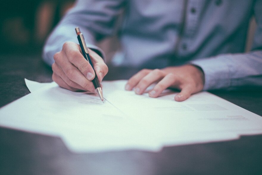 Man writing his signature