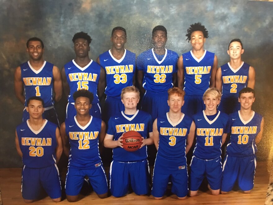 Scottie Barnes wears the number 5 jersey in this freshman year photo shoot for Cardinal Newman High School.