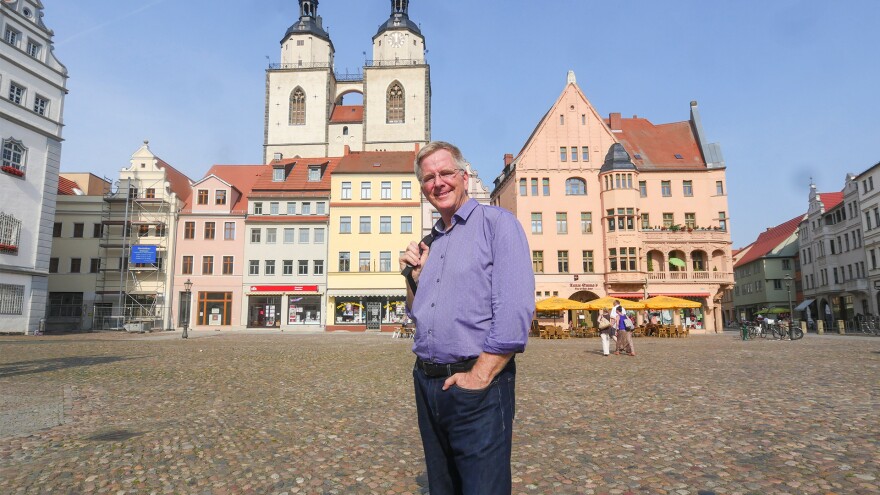 Rick Steves standing in market square in Wittenberg, Germany