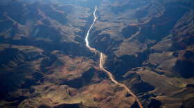 Bright Angel Canyon, middle left, the scene of flash floods, meets with the Colorado River in the Grand Canyon, Monday, Aug. 31, 2026, at Grand Canyon National Park, Ariz.