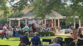 Candidates gather under the gazebo on Ozark's courthouse lawn, ahead of a forum with Christian County voters.
