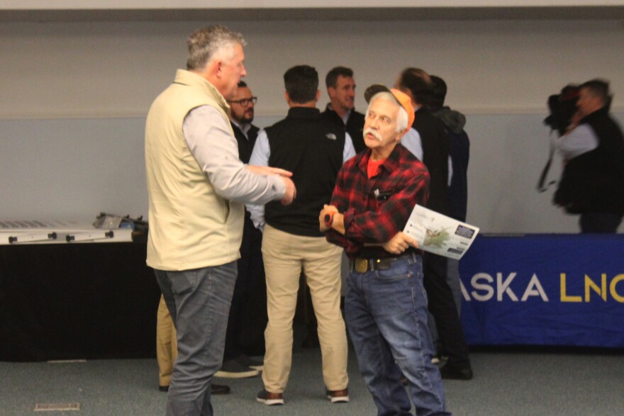Brad Chastain (left) and Robin Bogard (right) talk during an Alaska LNG Project town hall on Wednesday, Oct. 8, 2025 in Nikiski, Alaska.